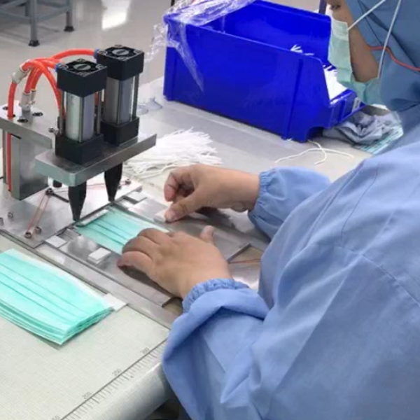 KMUTT lecturers assist Thai mask industry by innovating equipment and streamlining the process to boost production by 30%